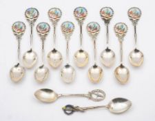 A matched set of ten silver and enamel teaspoons, various makers and dates: initialled,