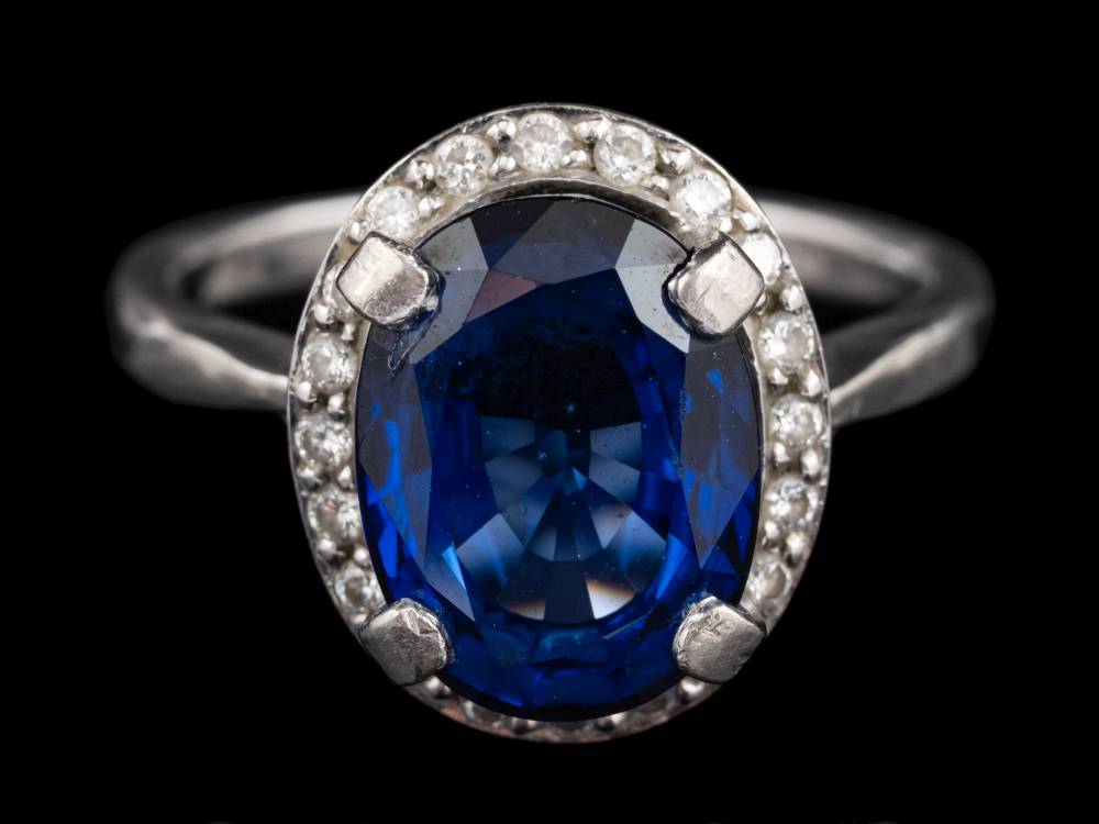 A diffusion treated sapphire and diamond ring,