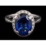 A diffusion treated sapphire and diamond ring,