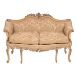 A carved and painted beech and silk damask upholstered sofa in Italian 18th century taste,
