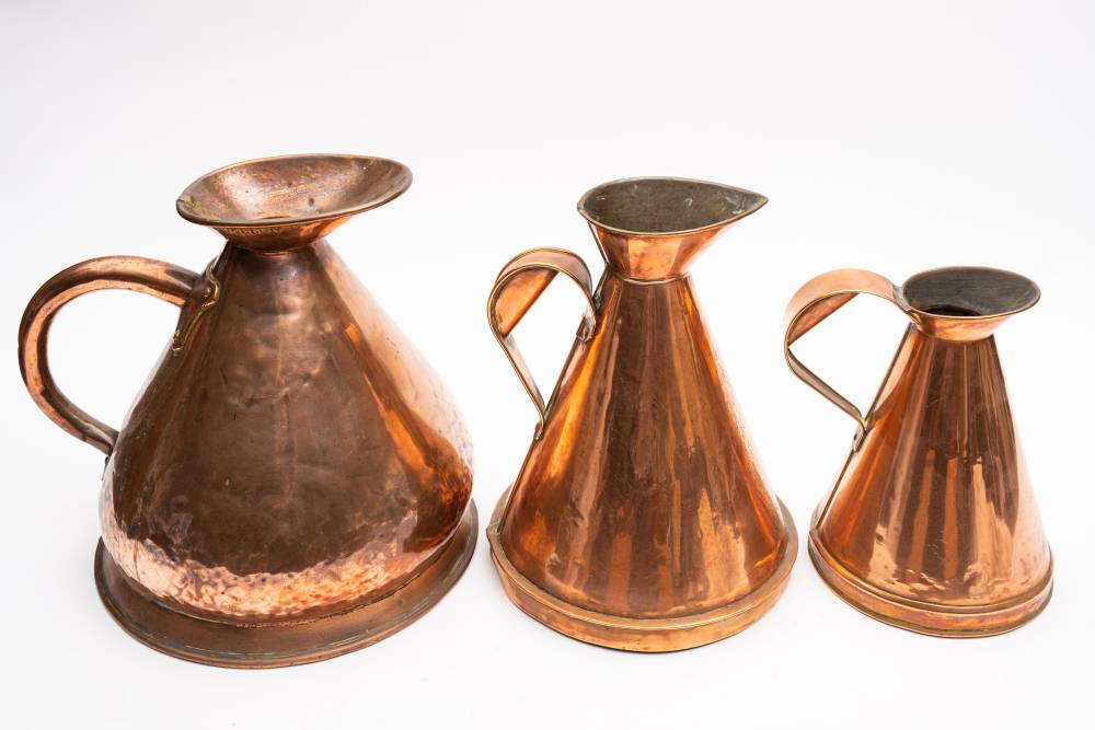 A 19th century copper harvest jug: of traditional design,