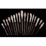 A collection of fifteen assorted small silver-handled button hooks,
