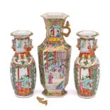 A Chinese Canton famille rose hexagonal vase and a pair of similar baluster vases: the first