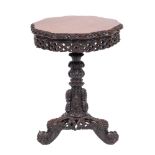 An Anglo Indian carved and stained hardwood circular occasional table, Bombay Presidency,