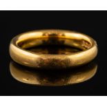 A 22 carat gold ring,: of plain polished form, stamped 22 with full Birmingham hallmarks,