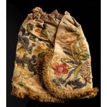 A 17th century silk work coif or biggin: decorated with flowers,