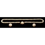 A cultured pearl necklace,: composed of uniform 7mm cultured pearls, on a knotted string,