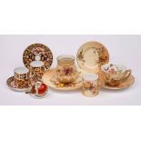 A mixed group of Royal Worcester and Royal Crown Derby porcelain: comprising a blush ivory cup and