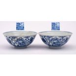 A pair of Chinese blue and white 'Eight Immortals' bowls: each exterior painted with the eight