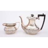 A late Victorian silver coffee pot and cream jug, maker Fordham & Faulkner, Sheffield,