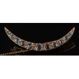 A sapphire and diamond crescent brooch:,