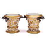 A pair of Chamberlain-Worcester jardinieres and stands: of tapering cylindrical form with 'bronzed'