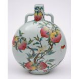 A Chinese famille rose 'peaches' moon flask: painted with bats flying amongst peach branches and