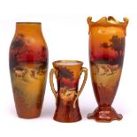Three Royal Doulton vases: one of compressed slender oviform with asymmetric foot and rim and
