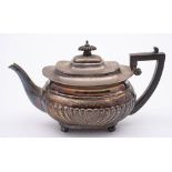 A Victorian silver teapot, maker Walter & John Barnard, London, 1894: of barge-shaped outline,