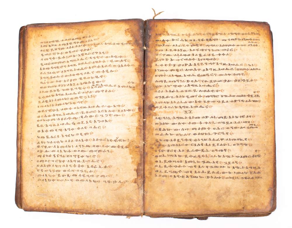 HOLY BOOK : hand written in a Coptic script, on heavily stained vellum, - Image 2 of 4