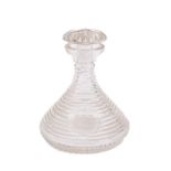 A 19th century ship's decanter: the star cut mushroom stopper over stepped body with wheel engraved