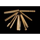 A set of ten 19th century bone teethers : including a hammer, pliers, a saw, a cricket bat,