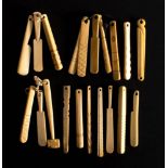 A collection of 19th century bone teethers: including a hammer, a saw and others.