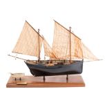 A scale model of the Mevagissey Lugger FY150 'Margaret' by D Proctor: fully rigged above open deck