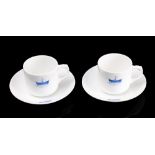 A pair of Royal Navy Hospital HMS Dreadnought coffee cups and saucers by Adderley: with blue glaze
