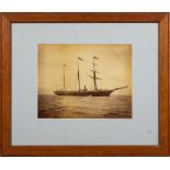 Two late 19th/ early 20th century photographs of HMS Surprise: one with white ensigns as an