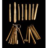 A collection of 19th century bone teethers: including a hammer , a cricket bat and others.