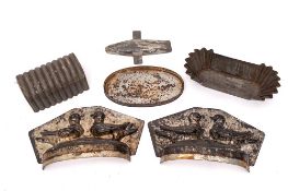 A tin two-section pie mould: decorated with two birds and a collection of pastry cutters, etc.