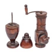 A turned wood coffee grinder: with iron handle and scoop to base, held in by a screw thread,