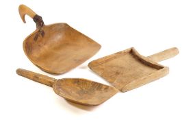 A 19th Century fruitwood flour scoop: with iron mounted handle and two other flour scoops.