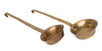 Two 19th Century brass circular cream ladles:.