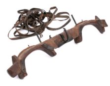 A 19th Century iron mounted wood yoke: with various leather straps, 122cm long.