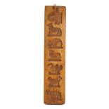 A rectangular fruitwood biscuit mould: with seven bird and animal impressions to one side and