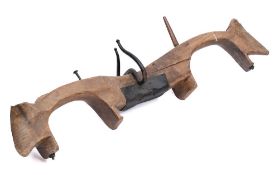 A 19th Century fruitwood and iron mounted yoke:, 122cm long.
