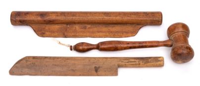 A baguette rolling pin:, 43cm long, a fruitwood curd knife, 40cm long and a treen mallet, 32cm long.