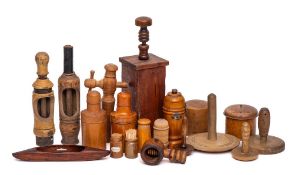 Two 19th Century treen butter workers:, a screw type nutcracker, two wood and metal bound rollers,