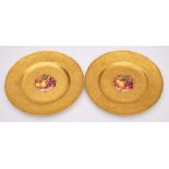 A pair of Royal Worcester porcelain cabinet plates: each decorated with a panel of apples ,