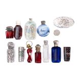 A collection of silver and gilt metal mounted scent bottles,