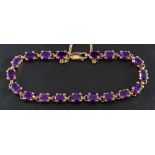 An oval, mixed-cut, amethyst bracelet,: estimated total amethyst weight ca.