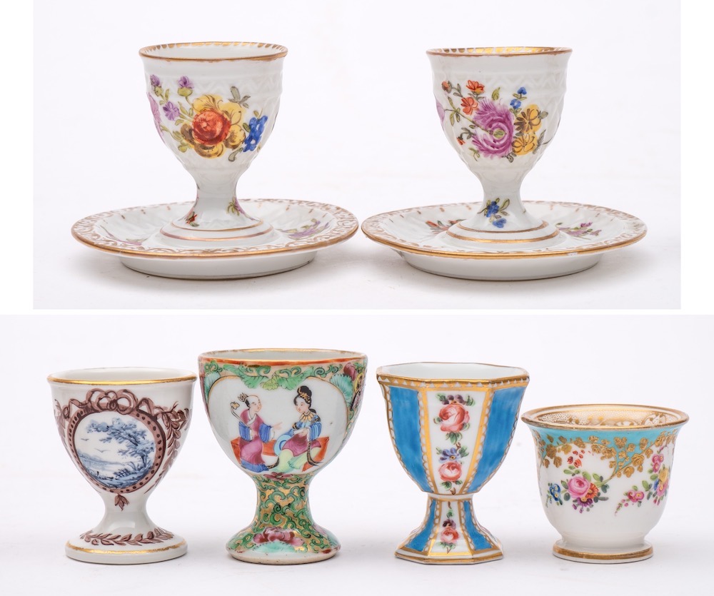 A group of six Continental and other egg cups: including a Sevres-style cup painted with pendant