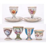 A group of six Continental and other egg cups: including a Sevres-style cup painted with pendant