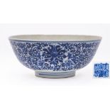 A Chinese blue and white 'lotus' bowl: the exterior painted with flowering lotus amongst scrolling
