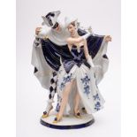 A Royal Dux Bohemia porcelain group: of an elegant couple dancing at a masquerade ball,