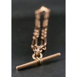 A figaro-link watch chain,: with T-bar and two dog clips, one of which is stamped '15ct',