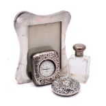 A mixed lot of silver wares, various makers and dates: includes a photograph frame,