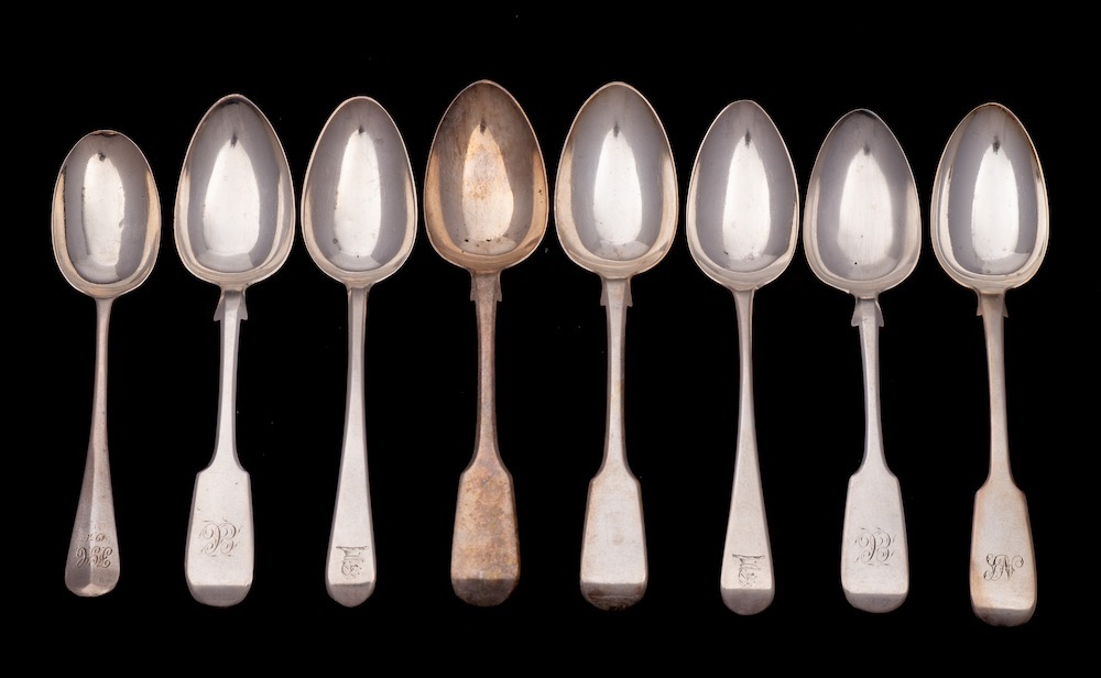 Five assorted silver Fiddle pattern dessert spoons, various makers and dates: three initialled,