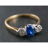 A sapphire and old-cut diamond ring, three-stone ring,: total estimated diamond weight ca. 0.