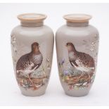 A pair of late 19th/early 20th century opaque glass vases: each enamelled with a vignette of a