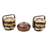 Two Chinese black and gilt lacquered twin section rice containers: of circular outline decorated