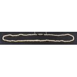 A graduated, single row, pearl necklace to an old-cut diamond clasp,